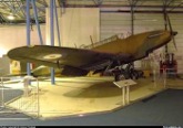Completed aircraft on display in a museum hangar